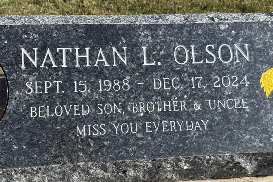 Blue Pearl granite on a slant marker with a porcelain portrait inset